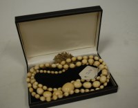 Lot 444 - A 19th century beaded ivory single string...