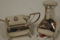 Lot 453 - A George V silver pepperette and matching...