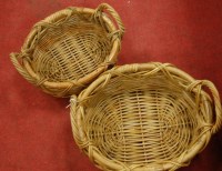 Lot 544 - A set of two graduated wicker baskets