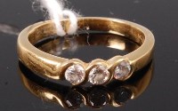 Lot 352 - An 18ct gold and diamond three stone ring,...