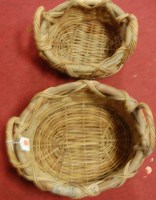 Lot 582 - A graduated set of two wicker baskets