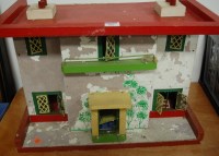 Lot 583 - A wooden handpainted two storey dolls house...