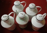 Lot 641 - Five various enamelled floral decorated jugs...