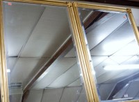 Lot 1015 - A pair of modern gilt framed wall mirrors