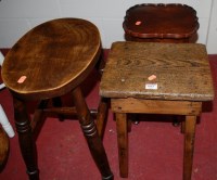 Lot 1063 - Two various milking stools and a small...