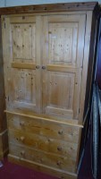 Lot 1070 - A modern pine linenpress, having a moulded...