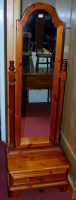 Lot 1072 - A modern Ducal stained pine cheval mirror, on...