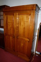Lot 1078 - A Mark Elliott cherrywood wardrobe, having a...