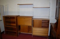 Lot 1080 - A 1970s teak Ladderax wall unit, having...