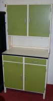 Lot 1081 - A 1950s cream and green painted kitchen...