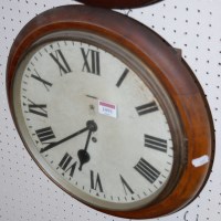Lot 1091 - An Elizabeth II stained beech GPO wall clock,...