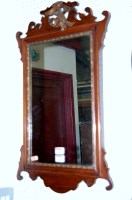 Lot 1093 - A circa 1900 mahogany fret carved wall mirror,...