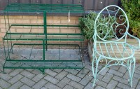 Lot 1096 - A modern green painted iron three tier plant...