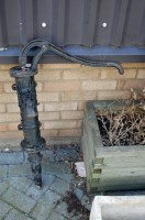 Lot 1101 - A black painted cast iron garden pump