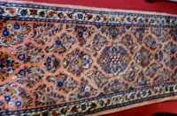 Lot 1118 - A Persian woollen runner of asymmetrical...