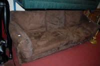 Lot 1132 - A contemporary suede upholstered three seater...