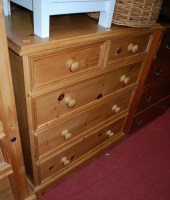 Lot 1173 - A modern pine chest of two short over three...