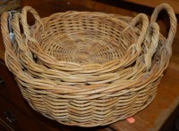 Lot 1179 - A graduated set of wicker twin handled baskets
