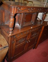 Lot 1186 - An early 20th century oak court cupboard in...