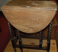Lot 1189 - A small 1920s oak gateleg dining table, the...