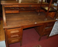 Lot 1192 - A 1930s oak pedestal desk, the D-shaped...