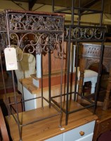 Lot 1193 - A pair of modern iron occasional tables, each...
