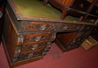 Lot 1204 - A large late Victorian carved oak pedestal...