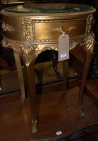 Lot 1155 - A reproduction French style occasional table,...
