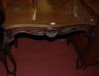 Lot 1156 - An Edwardian walnut centre table, the shaped...
