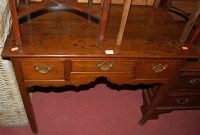 Lot 1235 - An early 19th century oak lowboy, the...