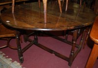 Lot 1242 - A 19th century oak gateleg table, the hinged...