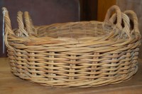 Lot 1161 - A graduated set of three wicker twin handled...