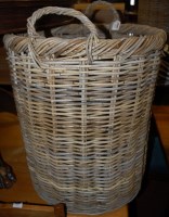 Lot 1251 - A large wicker circular twin handled basket