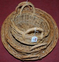 Lot 1256 - A graduated set of three wicker twin handled...