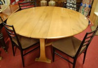 Lot 1267 - An Ercol mid-elm dropleaf dining table, w.126cm
