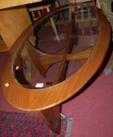 Lot 1271 - A 1970s teak and glass inset oval coffee table