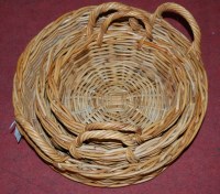 Lot 1273 - A graduated set of three circular wicker baskets