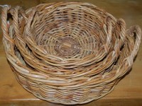 Lot 1276 - A graduated set of three circular wicker baskets