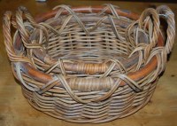 Lot 1277 - A graduated set of two oval wicker twin...