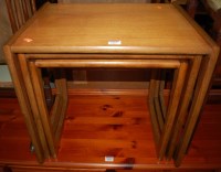 Lot 1319 - A nest of three 1970s teak occasional tables,...