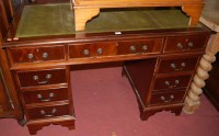 Lot 1332 - A reproduction pedestal desk having inset...