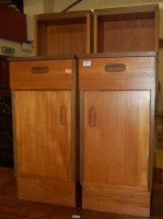 Lot 1334 - A pair of modern teak bedside cabinets each...