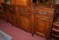 Lot 1335 - A Provincial French oak breakfront sideboard...