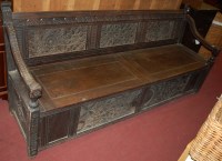 Lot 1339 - An early 20th century low relief carved oak...