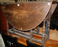 Lot 1343 - An 18th century oak gateleg table, the hinged...