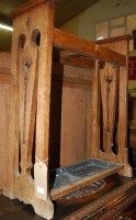 Lot 1210 - An Art Nouveau oak twin division stickstand,...