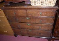 Lot 1226 - An 18th century oak chest of two short over...