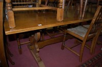 Lot 1247 - A modern oak refectory table, having a planked...