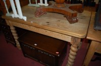 Lot 1329 - A pine kitchen table the rectangular top above...