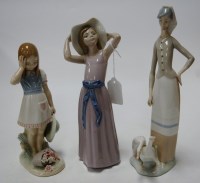 Lot 27 - A Lladro figure of a lady with geese at her...